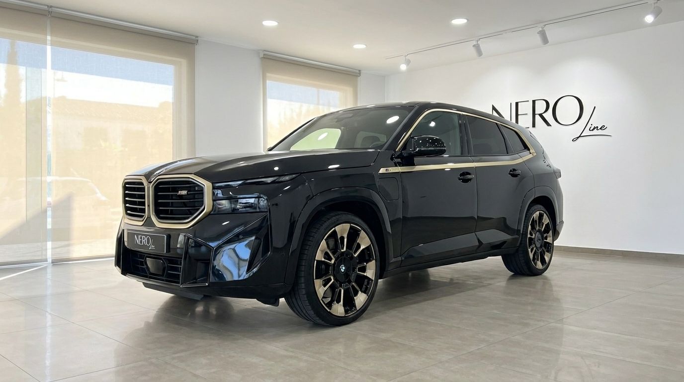 The black 2025 BMW XM performance SUV is showcased in a showroom with a front three-quarter view in Alicante.