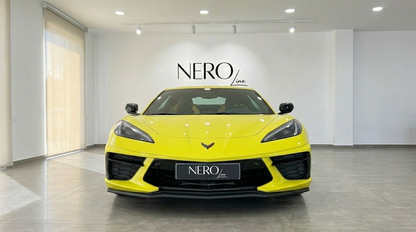 Neon yellow Chevrolet Corvette Stingray C8 supercar presented head-on in a bright showroom in Alicante.