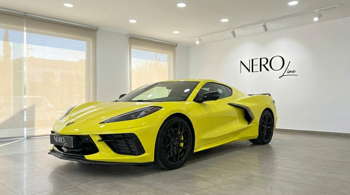 Chevrolet Corvette Stingray C8 — Showroom Alicante The neon yellow Chevrolet Corvette Stingray C8 is showcased from a front three-quarter view in a showroom in Alicante.