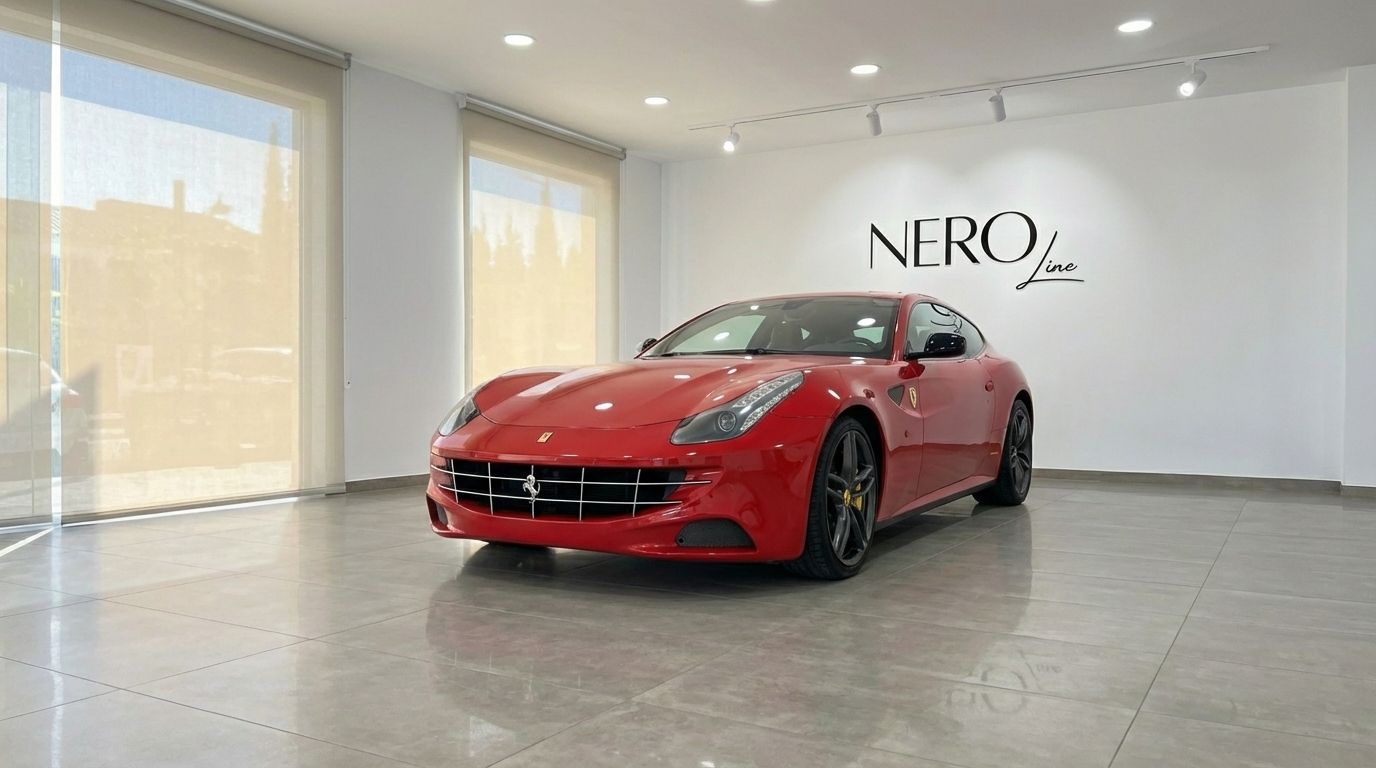 The racing red 2016 Ferrari FF is prominently displayed in a showroom with the Nero Line logo in Valencia.