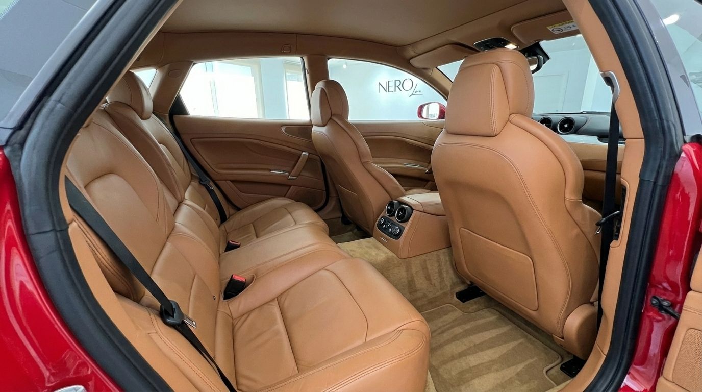 The luxurious tan leather rear seats and interior of the Ferrari FF, showcasing comfort and design in Valencia.