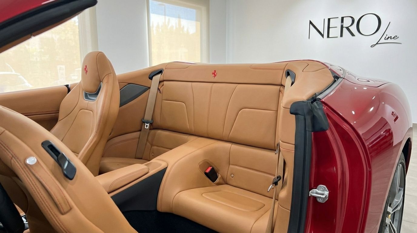 The luxurious tan leather interior of the Ferrari Portofino, showing the rear seats and front passenger seat in Marbella.