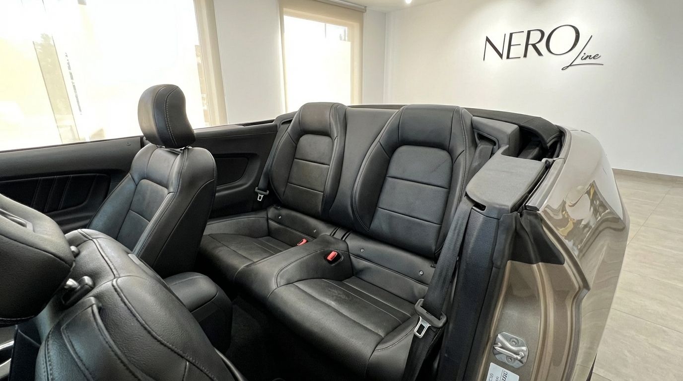 The image shows the black leather rear seats and part of the front seats of the Ford Mustang GT Convertible in Barcelona.