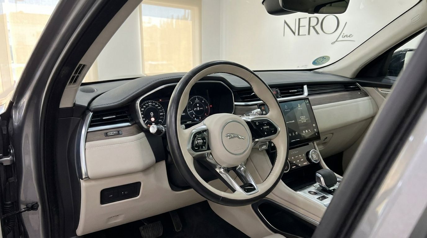 Jaguar F-Pace's luxurious cockpit in Alicante, featuring its elegant steering wheel and modern dashboard.