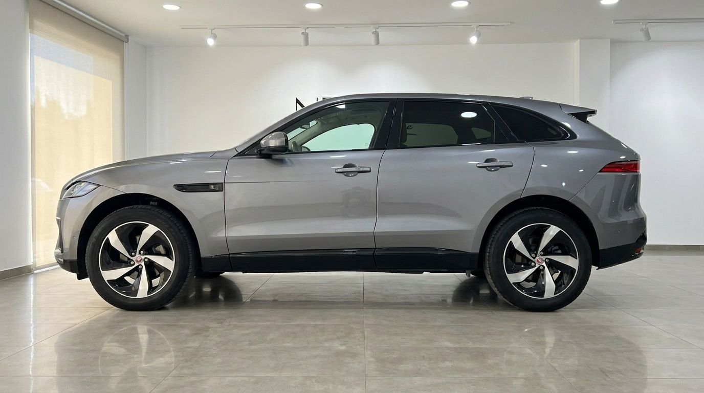 The 2022 Jaguar F-Pace in a sleek gray finish, viewed from its side profile, showcased in Alicante.