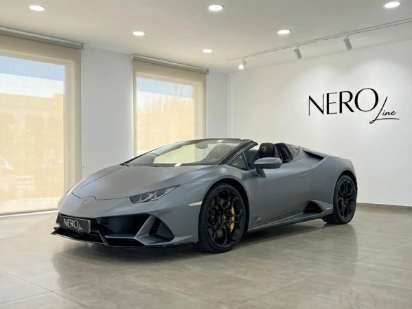 Lamborghini Huracan Evo Spyder — Ibiza showroom The matte gray Lamborghini Huracan Evo Spyder 60th Anniversary is elegantly displayed in a showroom in Ibiza.