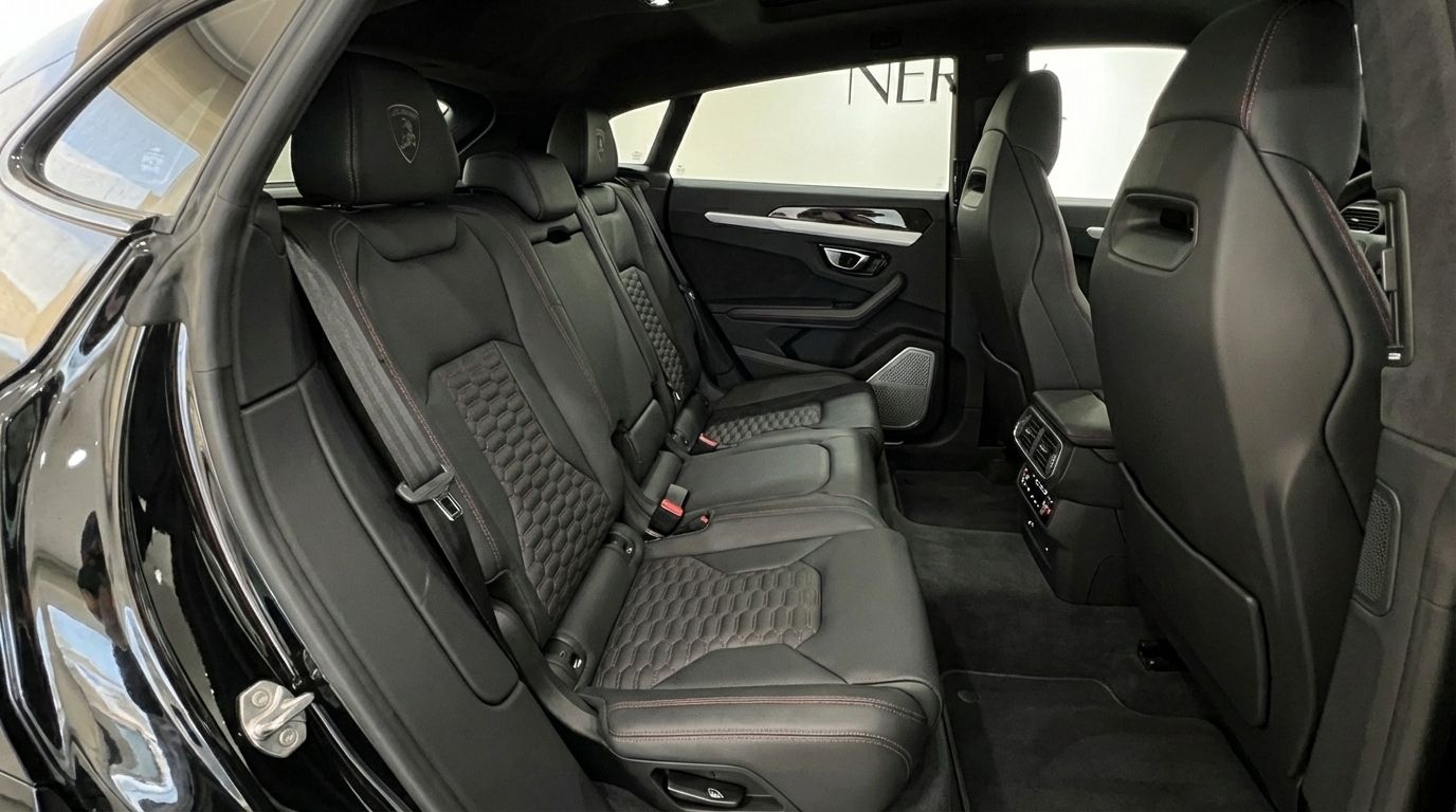 Lamborghini Urus SE's luxurious black leather rear cabin with quilted seats and red stitching, available in Alicante.