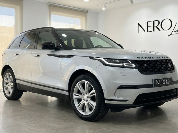 Land Rover Range Rover Velar — Showroom Alicante The 2021 silver Land Rover Range Rover Velar is parked at a front three-quarter angle in a showroom in Alicante.