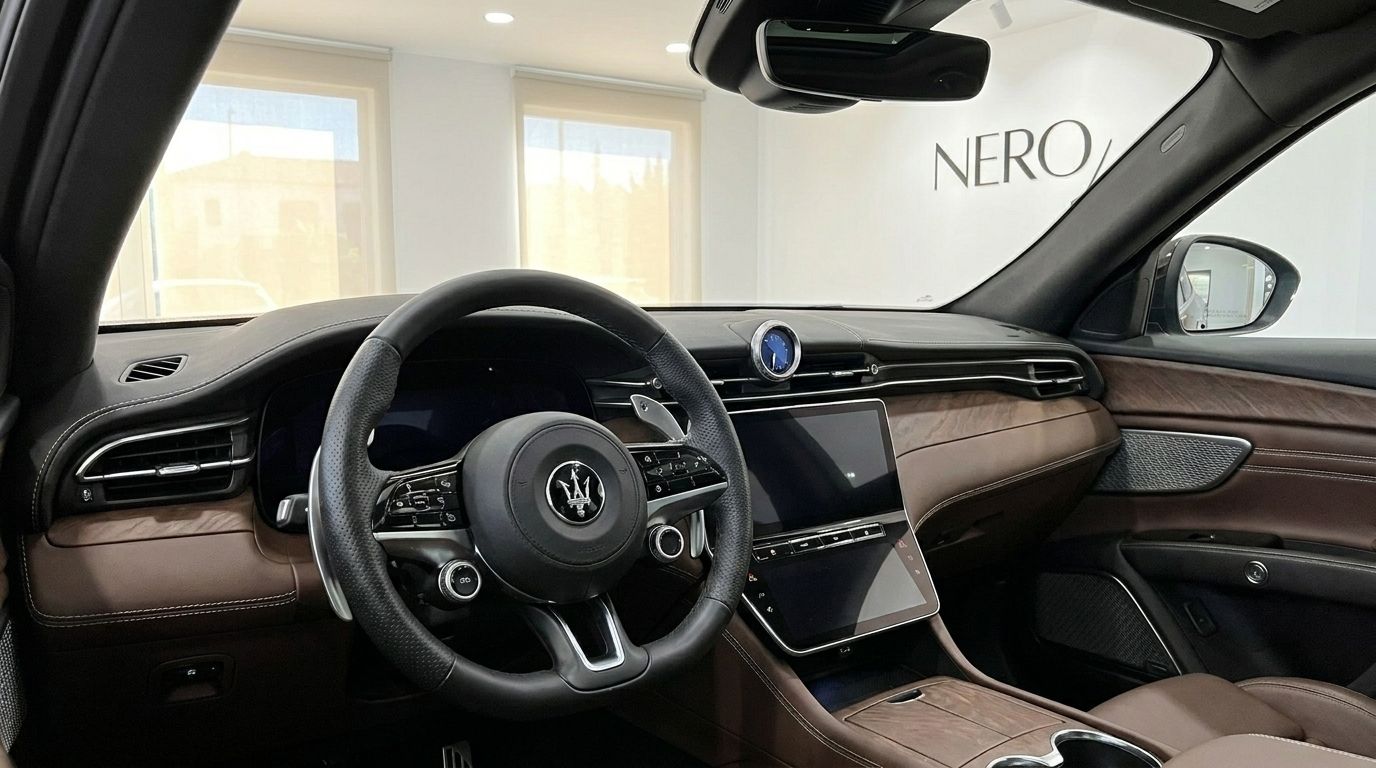 The luxurious brown leather interior and modern digital dashboard of the Maserati Grecale in Marbella.