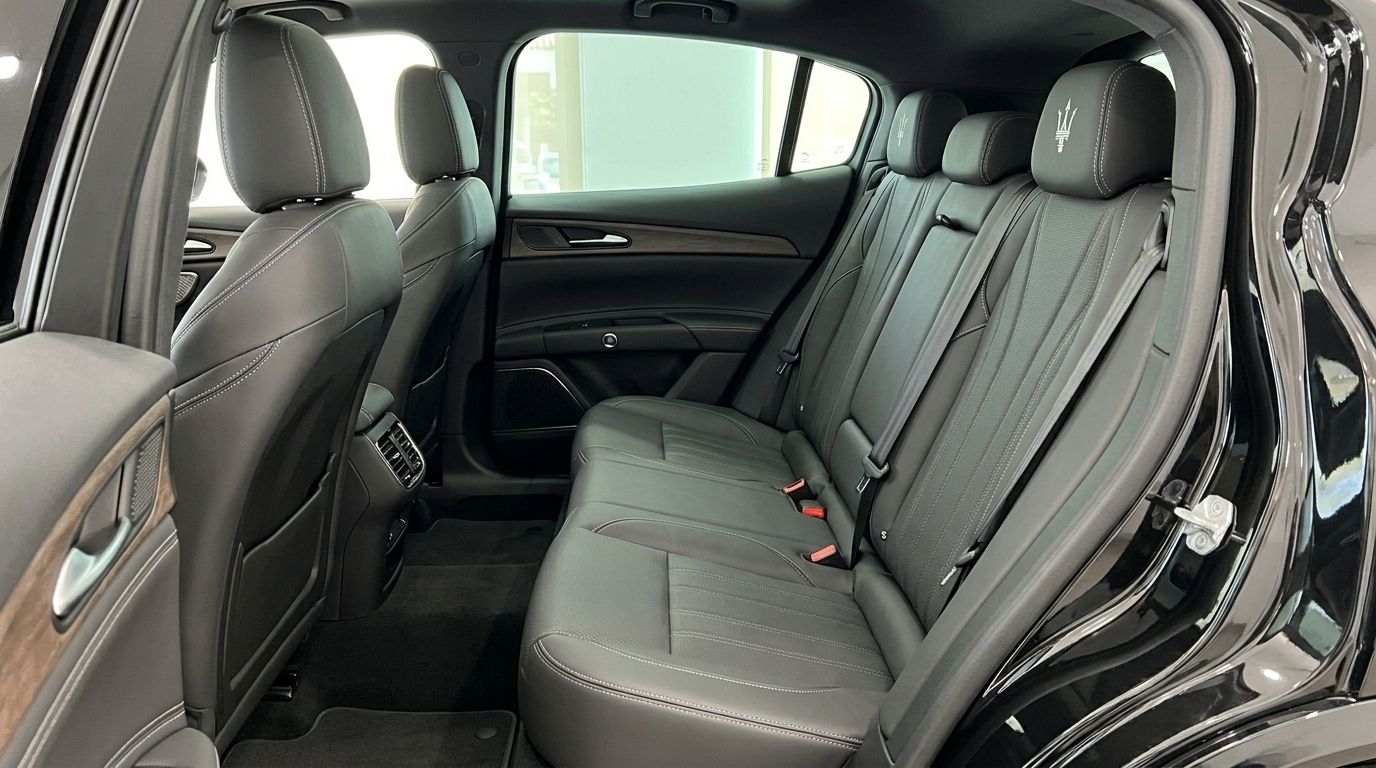 The luxurious black leather rear seats and interior of the 2024 Maserati Grecale, available for rent in Marbella.