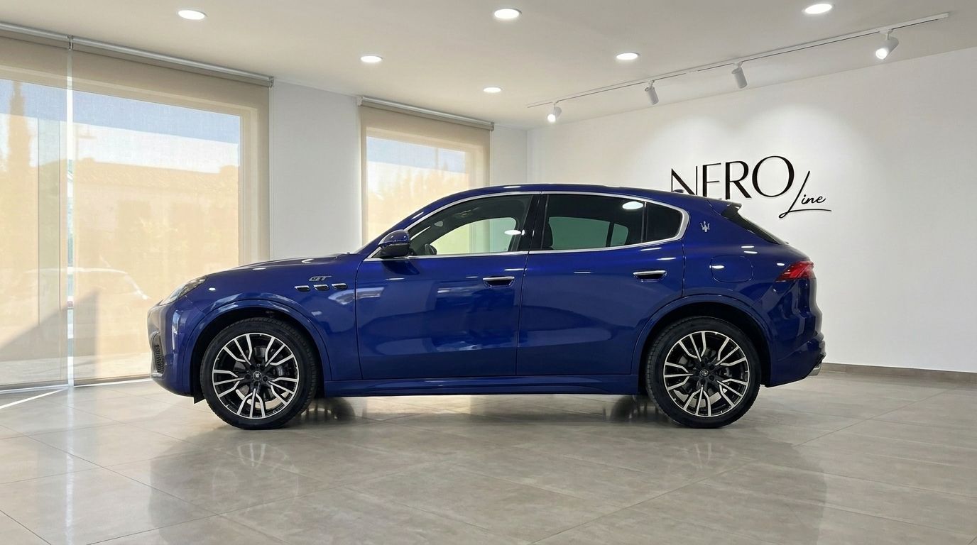 The metallic blue 2026 Maserati Grecale performance SUV shown from its left side profile in Benidorm.