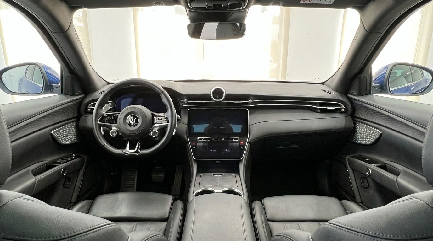 The luxurious interior of the 2026 Maserati Grecale, showcasing the dashboard, steering wheel, and central infotainment screen in Benidorm.