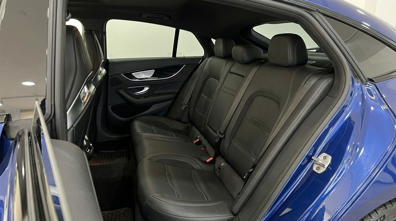 The luxurious black leather rear seats of the blue Mercedes-Benz AMG GT 4-Door Coupe in Alicante.