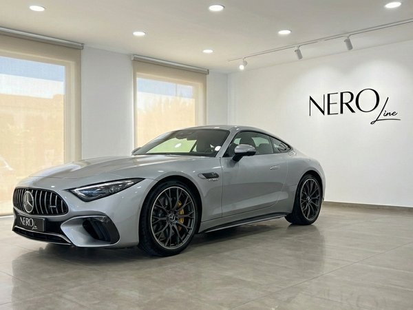 Mercedes-Benz AMG GT Roadster — Showroom Ibiza The 2025 Mercedes-Benz AMG GT Roadster in Silver Grey Metallic is showcased from a front three-quarter view inside a showroom in Ibiza.