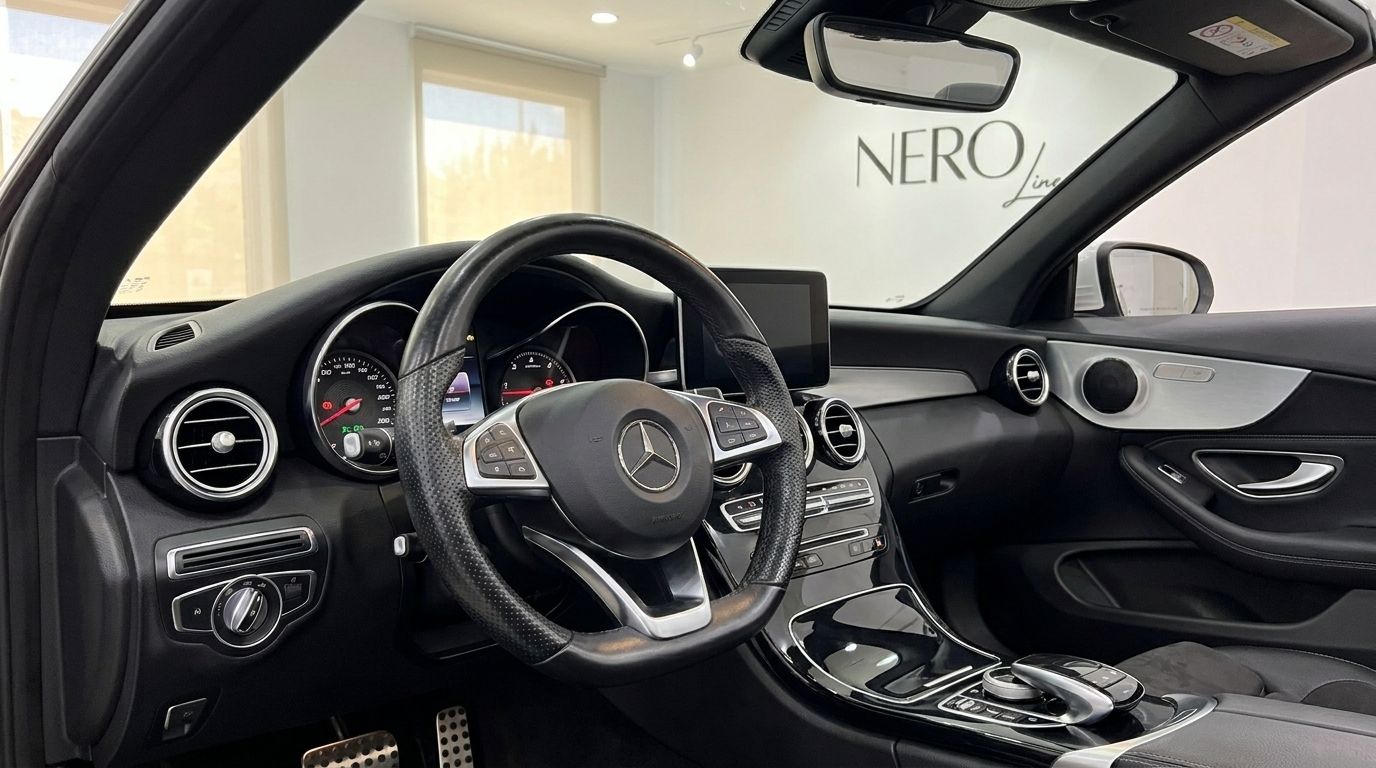 The luxurious interior dashboard and steering wheel of the Mercedes-Benz C 200 Cabriolet in Alicante.