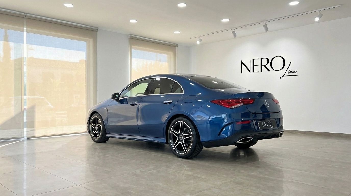The Gloss Metallic Blue Mercedes-Benz CLA is showcased from a rear three-quarter view in a Mallorca showroom.