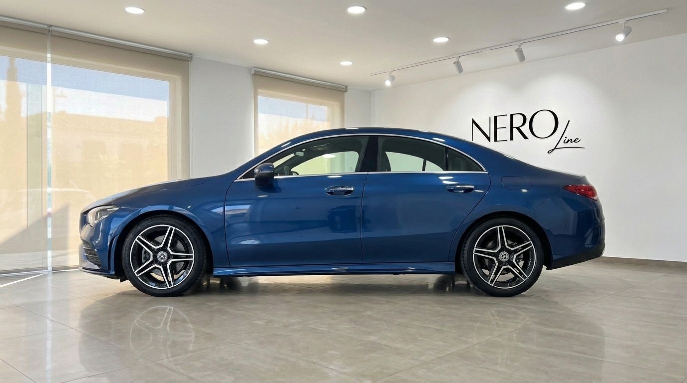 The blue 2022 Mercedes-Benz CLA is showcased in a showroom, highlighting its sleek side profile in Mallorca.