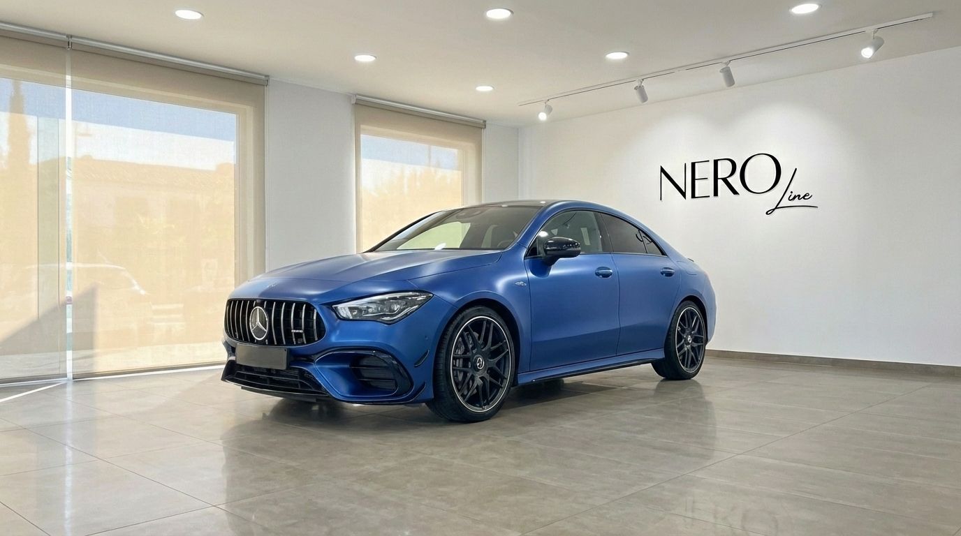 The matte blue Mercedes-Benz CLA 45s AMG is showcased from a front three-quarter angle in a modern showroom in Alicante.