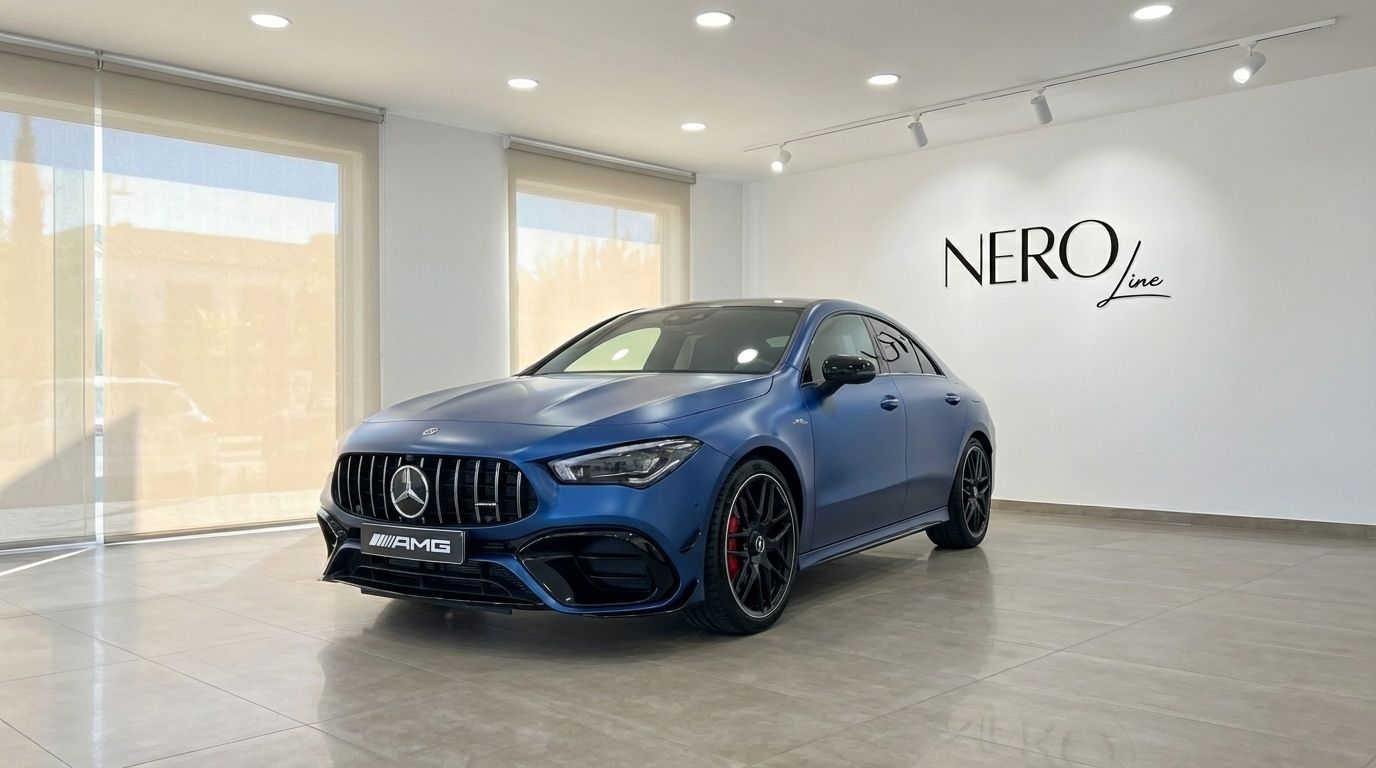 The matte blue Mercedes-Benz CLA 45s AMG is showcased from a front three-quarter view in a bright Alicante showroom.