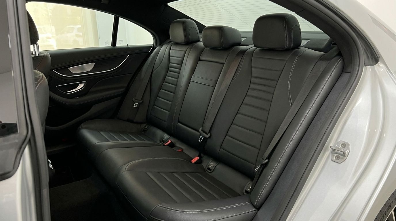 The Mercedes-Benz CLS 450 4MATIC in Alicante features luxurious black leather rear seats with detailed stitching.