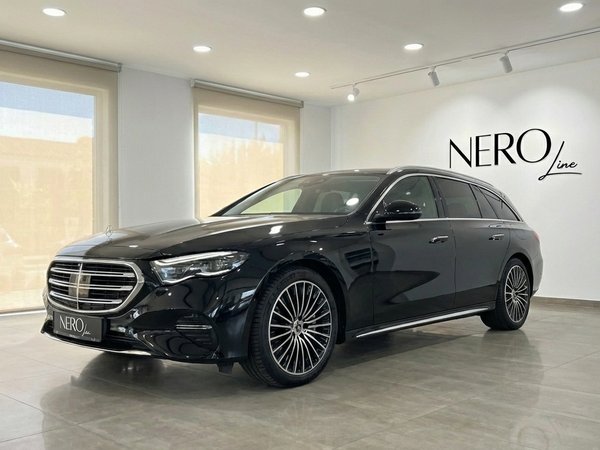 Mercedes-Benz E300e AMG line — Front view Alicante The black 2023 Mercedes-Benz E300e AMG line Estate is showcased from the front three-quarter view in Alicante.
