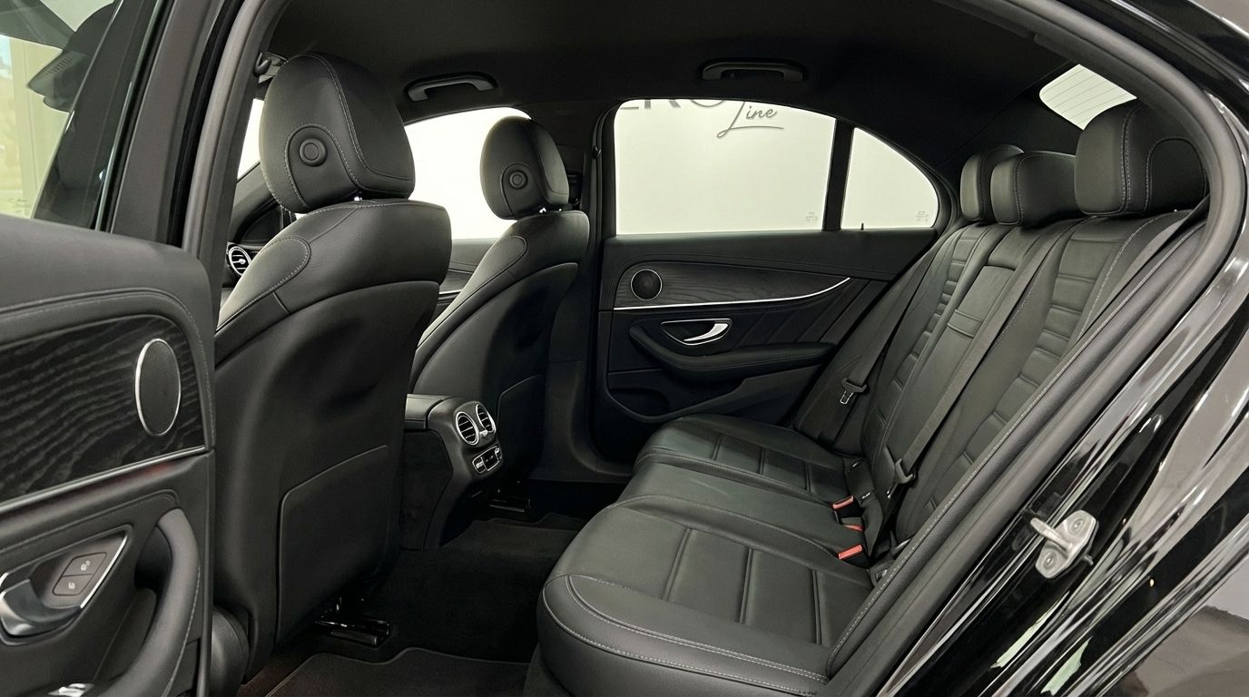 The luxurious black leather rear interior of the Mercedes-Benz E300e AMG line in Alicante.
