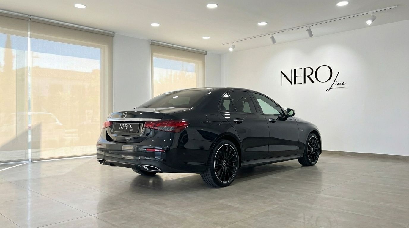 The black Mercedes-Benz E300e AMG line, a luxury plug-in hybrid, is parked in a showroom in Alicante.