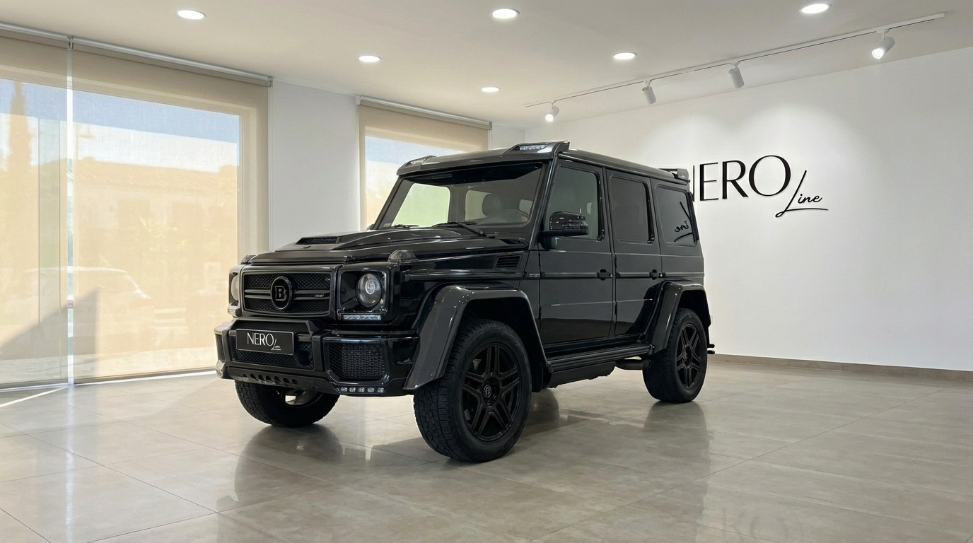 Mercedes-Benz G 500 — Front view in Marbella showroom A sleek black 2020 Mercedes-Benz G 500 is showcased from a front three-quarter view inside a bright Marbella showroom.