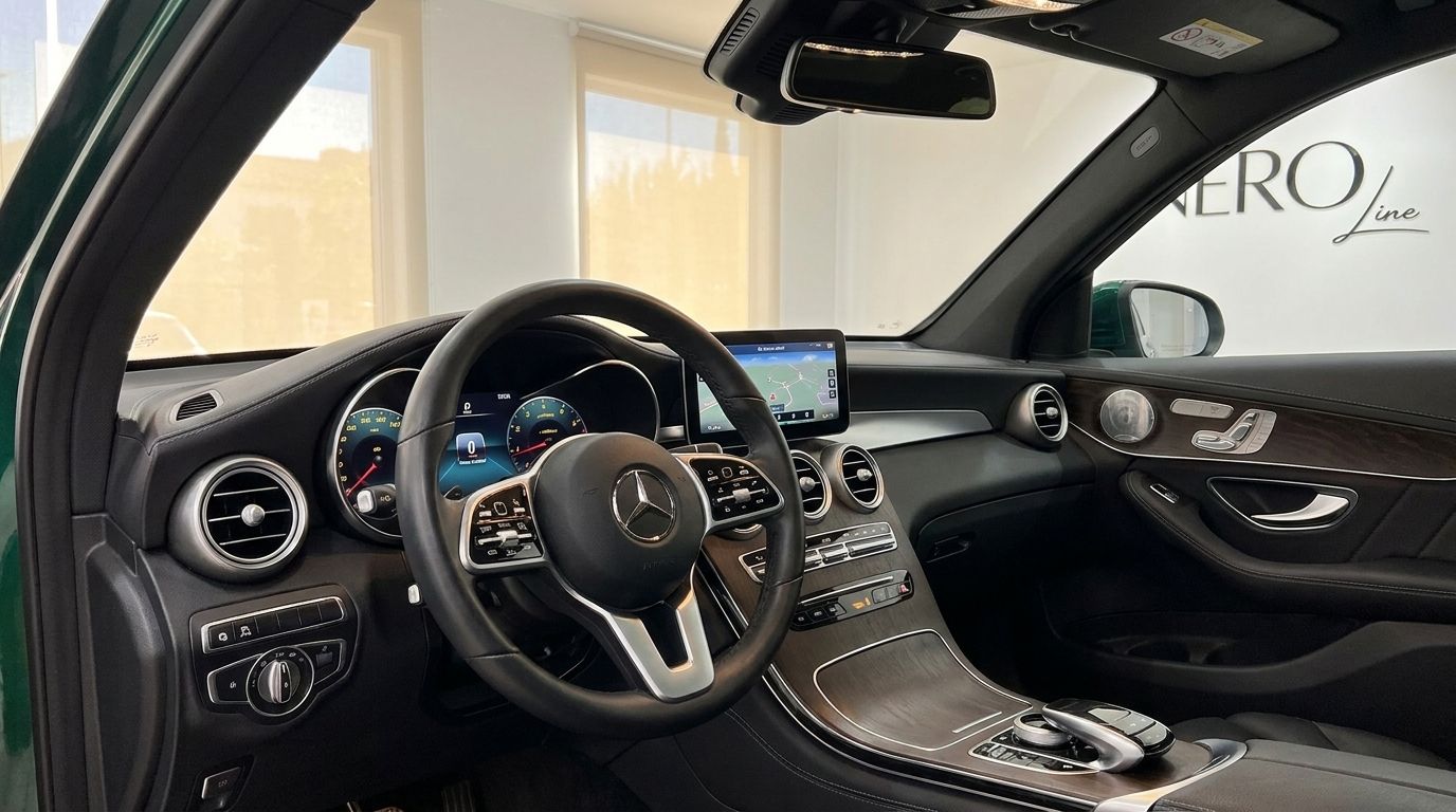The luxurious interior of the Mercedes-Benz GLC in Mallorca, featuring the dashboard, steering wheel, and central display with navigation.