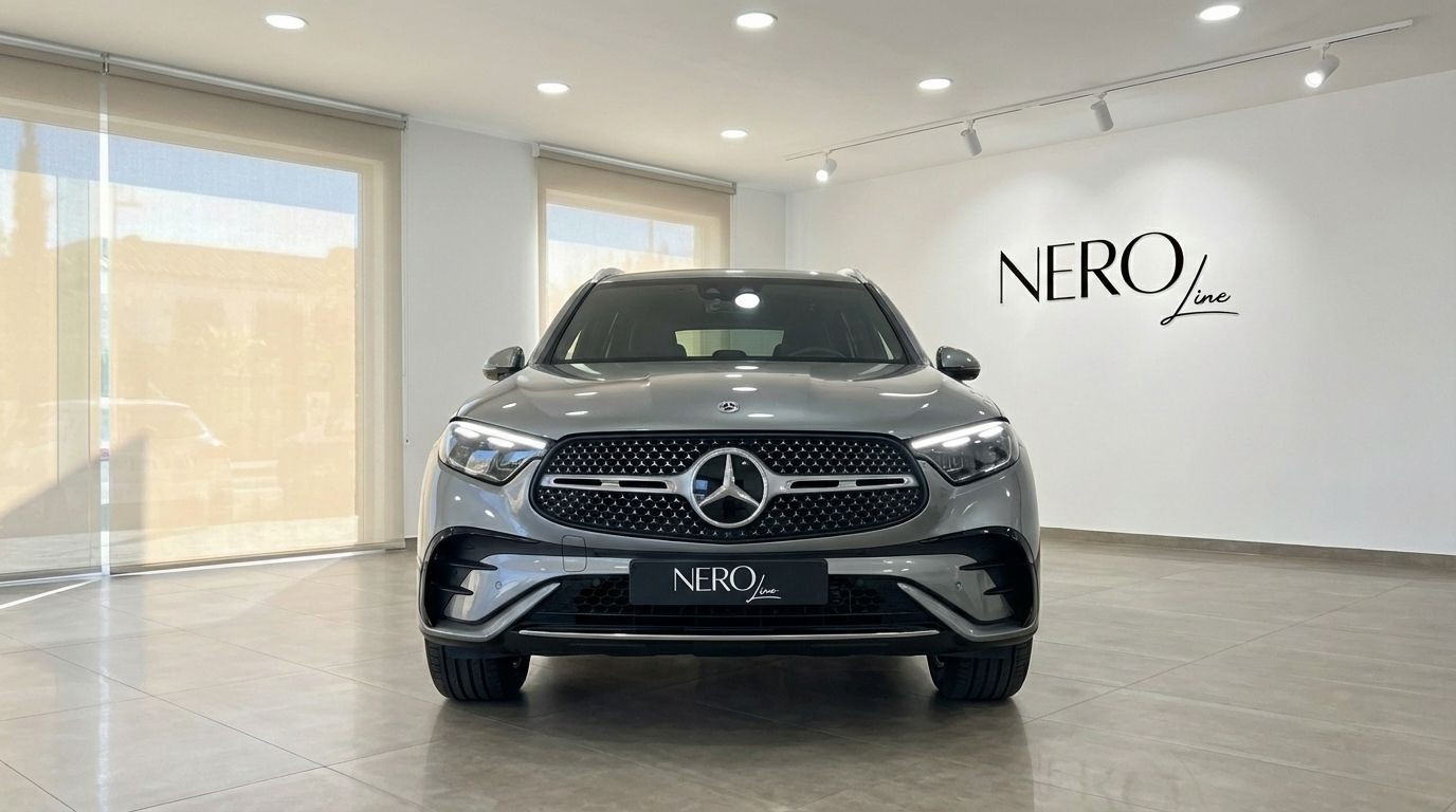 The metallic grey 2025 Mercedes-Benz GLC 200 is prominently displayed from the front in a showroom in Alicante.