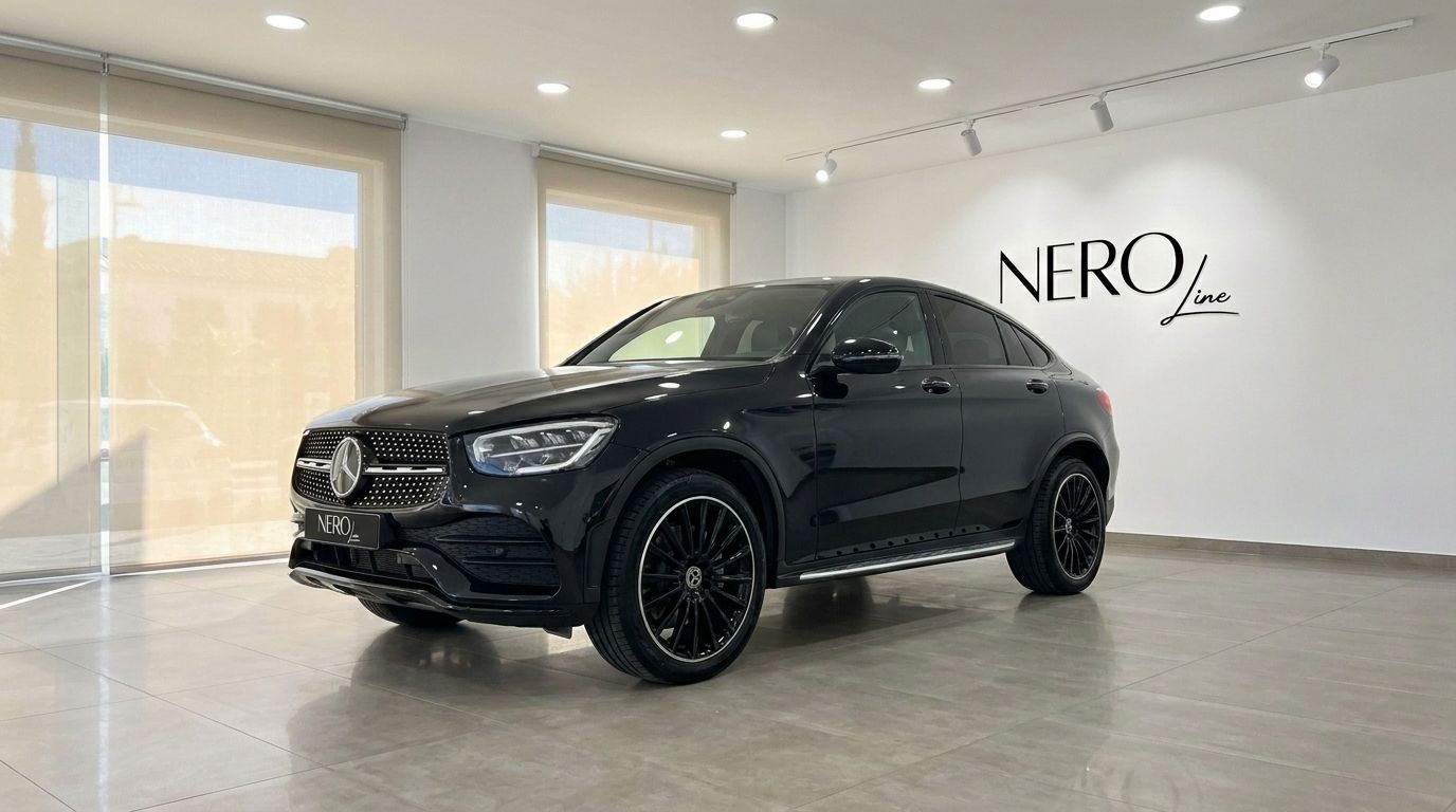 The black Mercedes-Benz GLC 300 AMG Line is showcased from a front three-quarter view inside a showroom in Ibiza.
