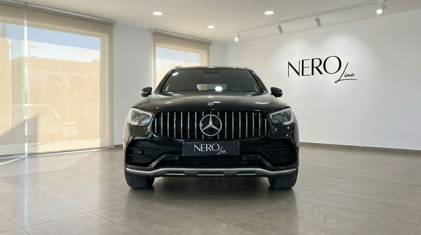 The front view of a black Mercedes-Benz GLC 300 AMG Line SUV in a showroom in Alicante, featuring its distinctive grille.