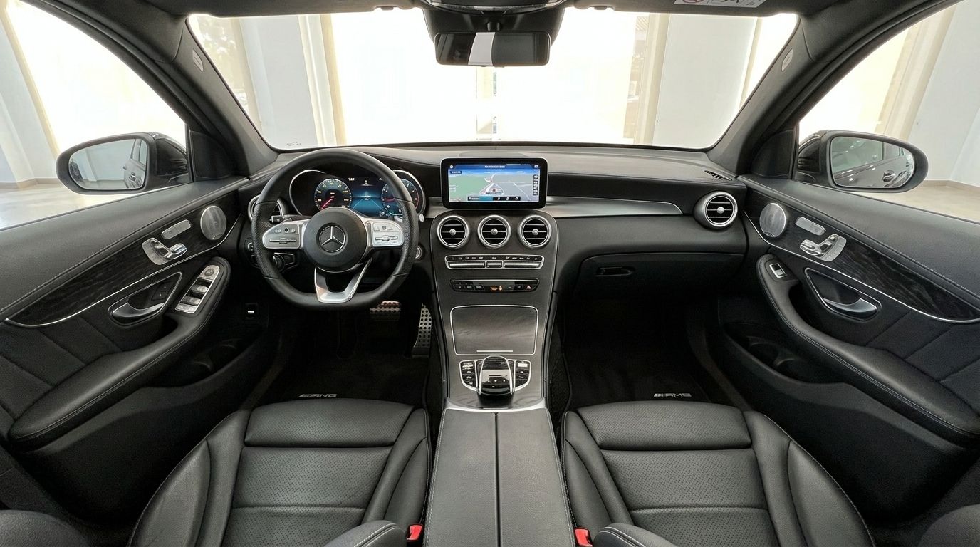 The luxurious interior of the Mercedes-Benz GLC 300 AMG Line in Alicante, featuring the dashboard, steering wheel, and infotainment system.