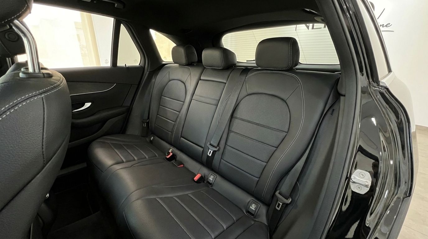 The Mercedes-Benz GLC 300 AMG Line's luxurious black leather rear seats with white stitching are visible in Alicante.