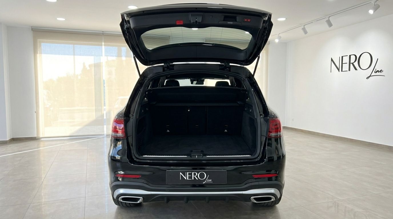 Rear view of the black Mercedes-Benz GLC 300 AMG Line with its spacious trunk open, showcased in Alicante.