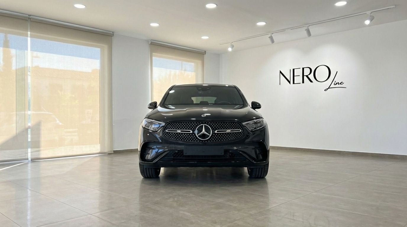 The metallic black 2025 Mercedes-Benz GLC 300d Coupe is prominently displayed from a head-on front view in a bright Alicante showroom.