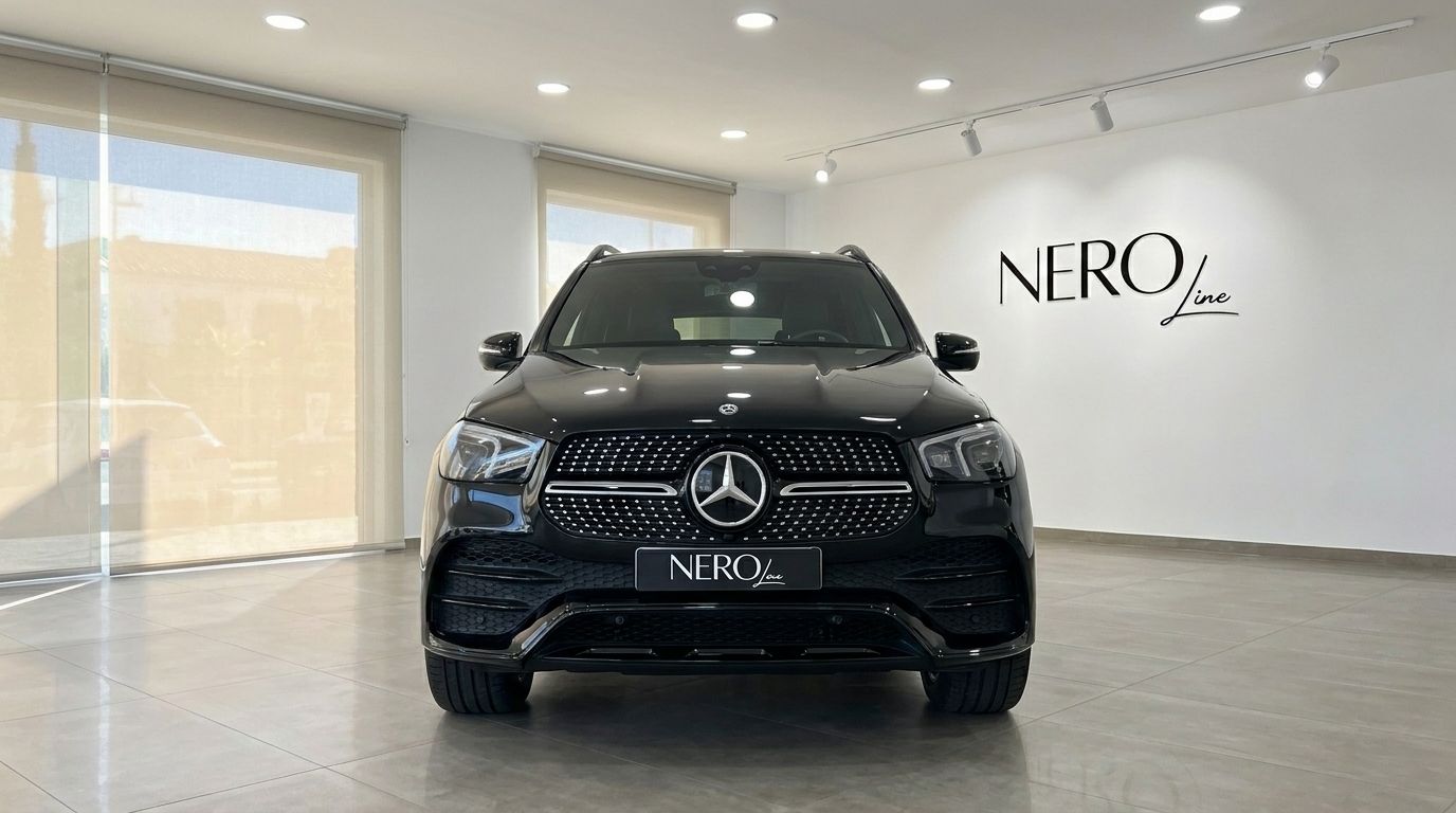 The sleek black Mercedes-Benz GLE 450d is showcased from a direct front view in a bright Marbella showroom.
