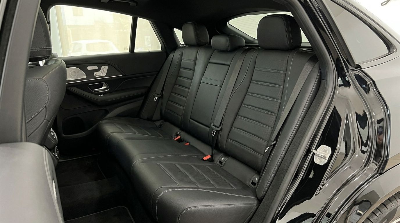 The luxurious black leather rear seats and interior of the Mercedes-Benz GLE 450d available for rent in Marbella.