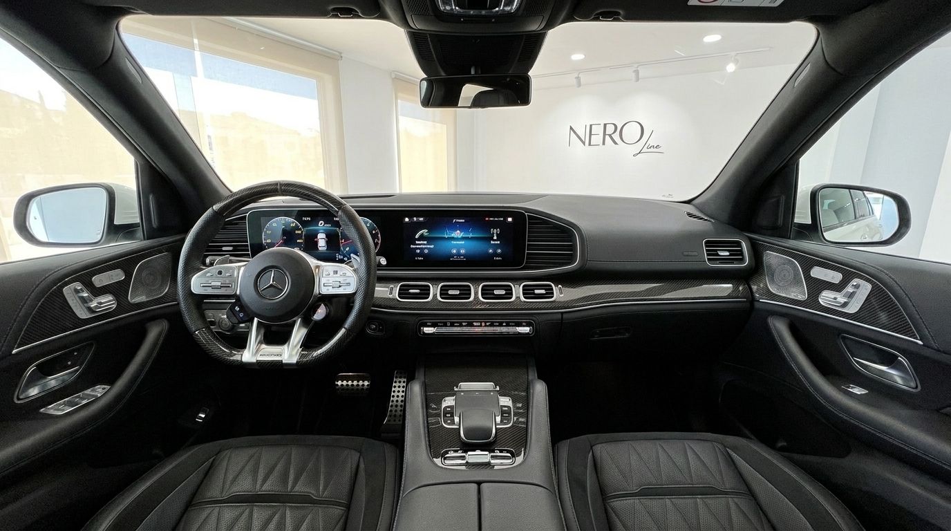 The luxurious interior of the Mercedes-Benz GLS 63 AMG in Alicante, showcasing the dashboard, steering wheel, and infotainment screens.