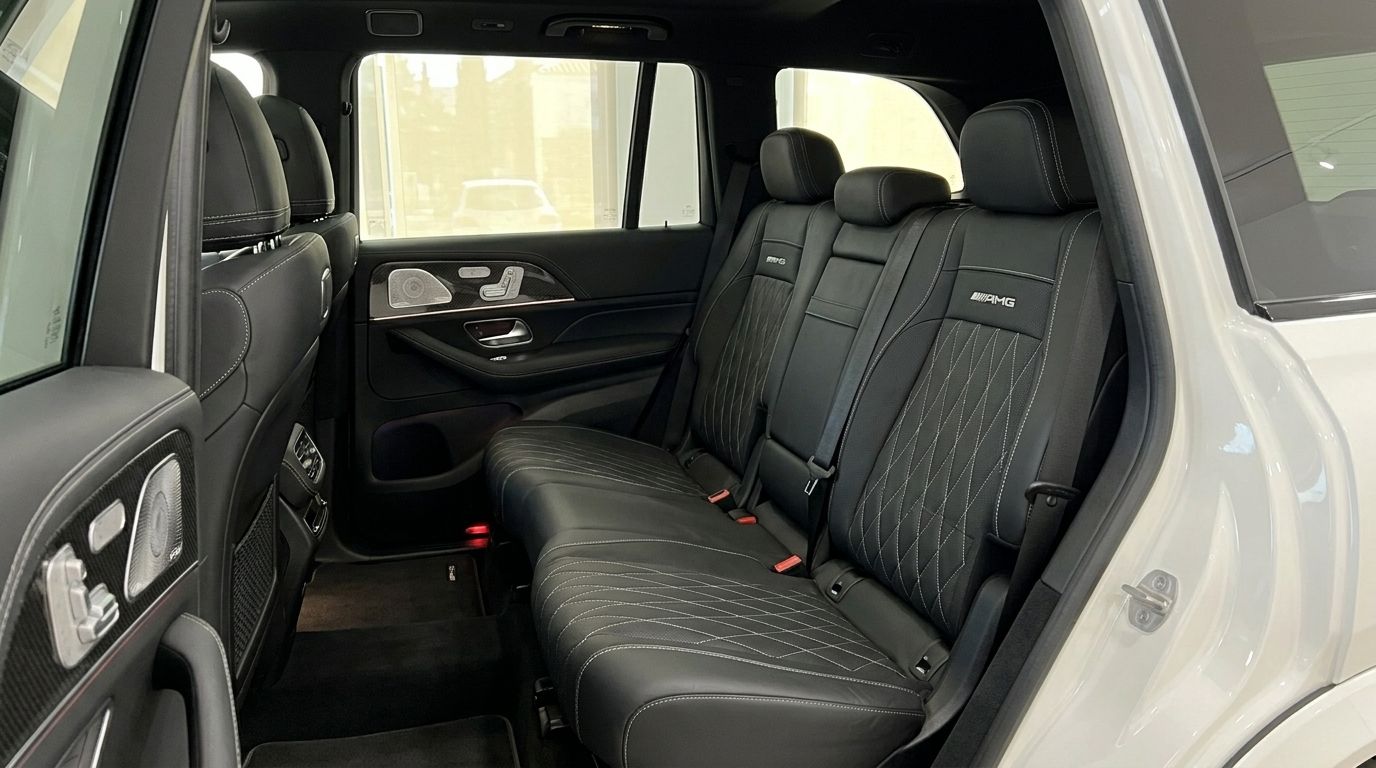 The luxurious black leather rear seats with prominent diamond stitching and AMG logo are visible inside the Mercedes-Benz GLS 63 AMG in Alicante.