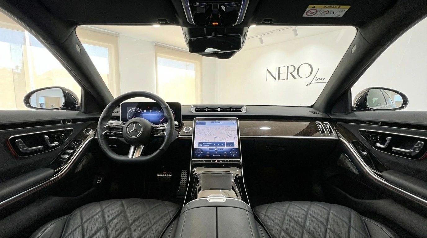 The luxurious cockpit interior of the 2025 Mercedes-Benz S350d, showcasing the steering wheel, digital displays, and quilted leather seats in Alicante.