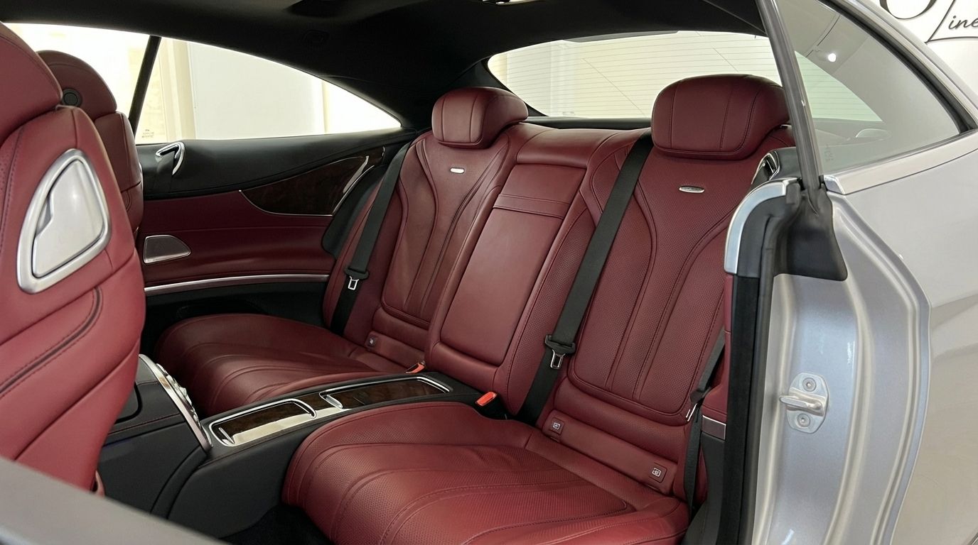 View of the opulent red leather rear seats and interior details of the Mercedes-Benz S500 Coupe available for rent in Alicante.