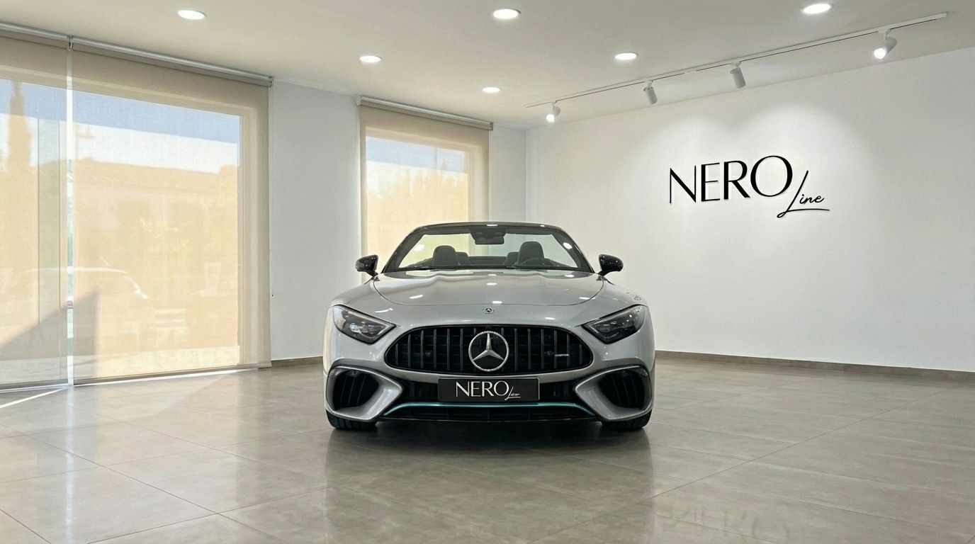 The 2023 Mercedes-Benz SL43 AMG, a grey luxury convertible, is prominently displayed head-on in a showroom in Alicante.