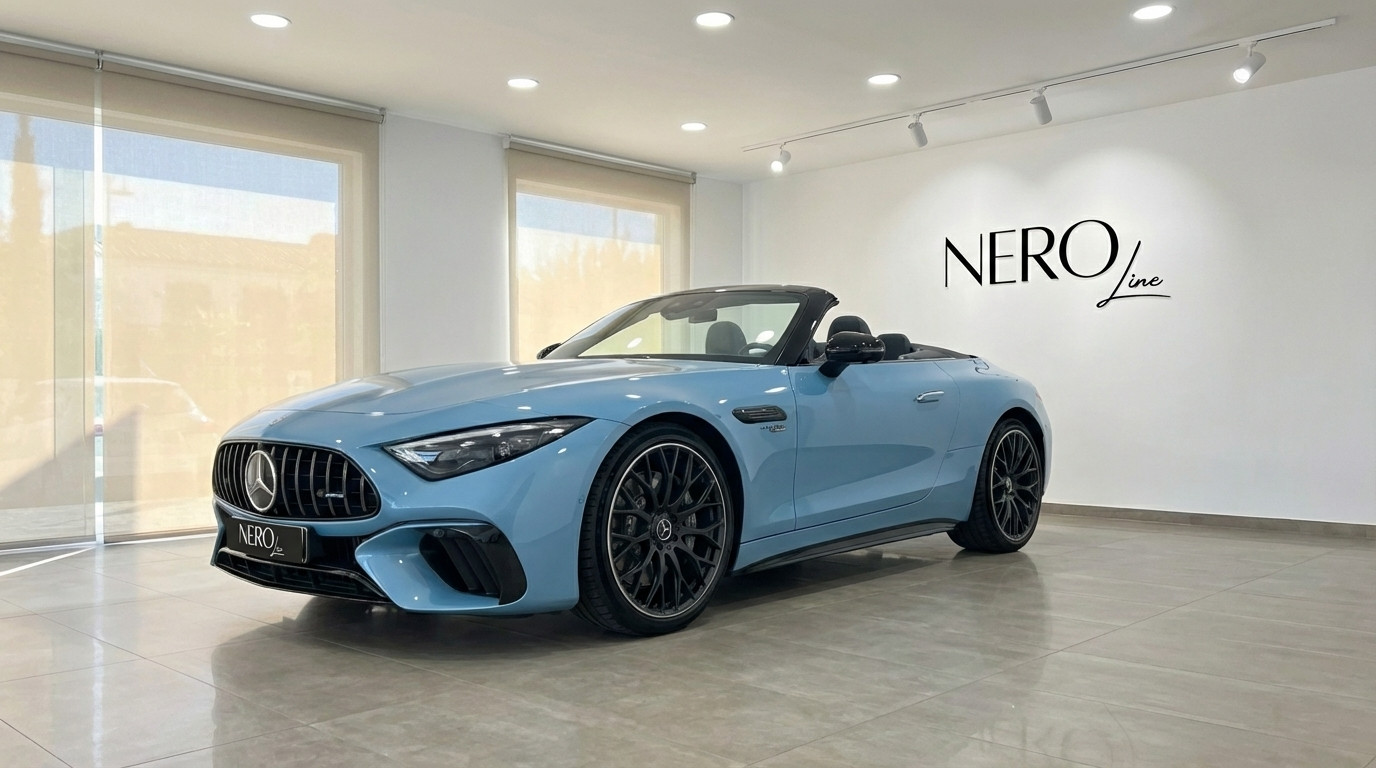 Mercedes-Benz SL63 AMG — Luxury Convertible in Showroom A baby blue Mercedes-Benz SL63 AMG convertible, with its top down, is elegantly displayed in a showroom in Alicante.