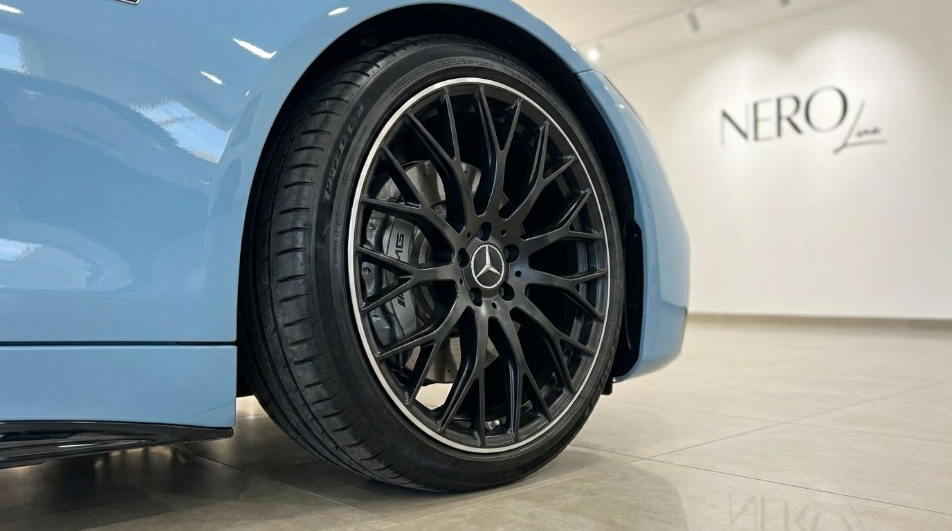 Mercedes-Benz SL63 AMG's baby blue body and black multi-spoke front wheel with AMG brake calipers in Alicante.