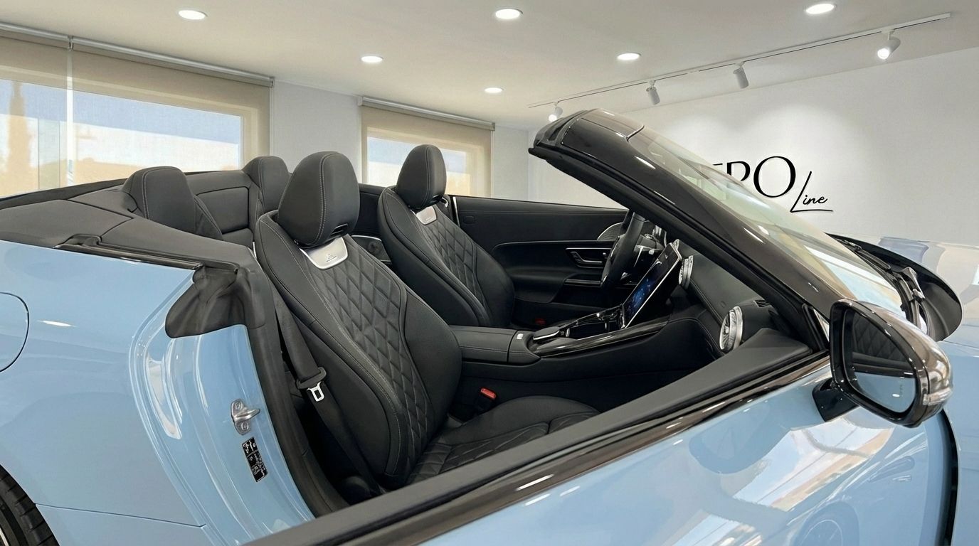 The luxurious black leather interior and open cockpit of the baby blue Mercedes-Benz SL63 AMG convertible in Alicante.