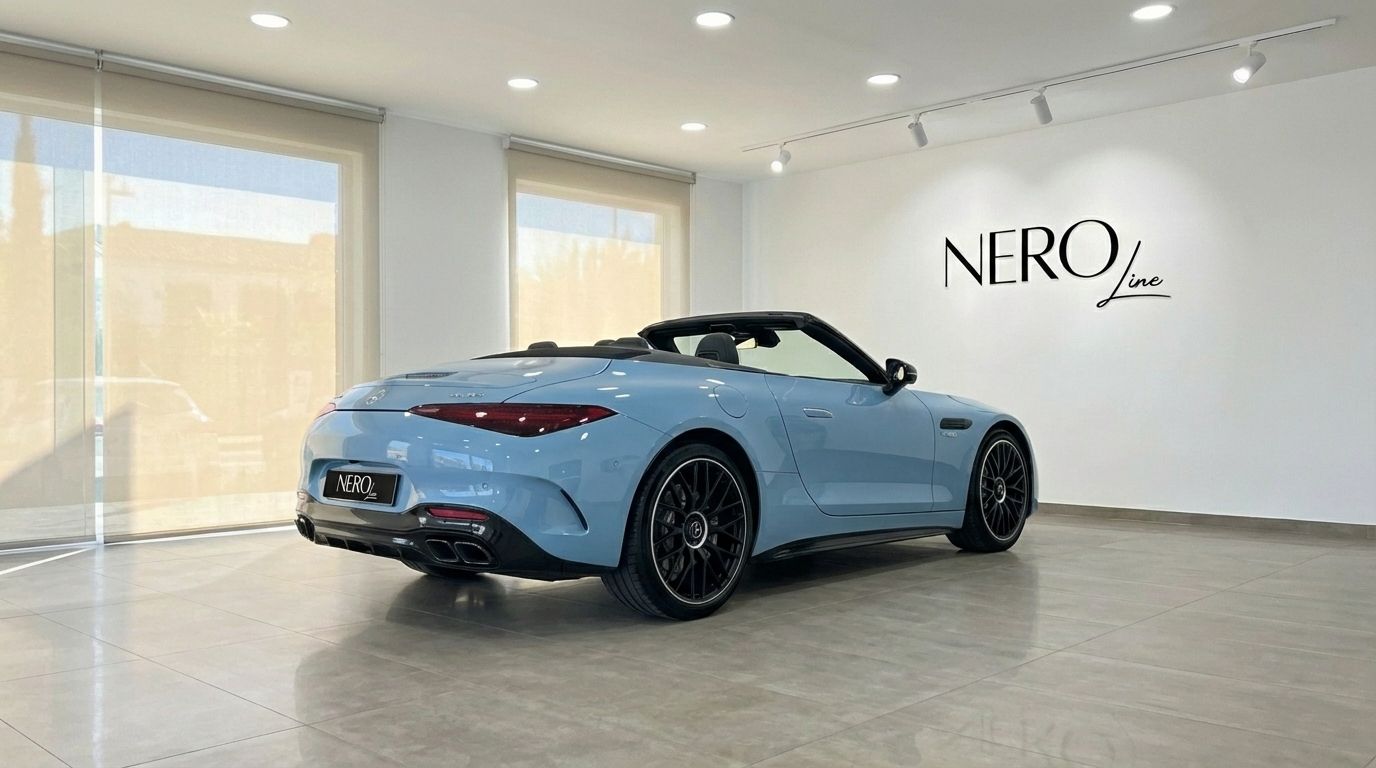 The baby blue 2024 Mercedes-Benz SL63 AMG convertible, with its top down, is showcased in a bright Alicante showroom.
