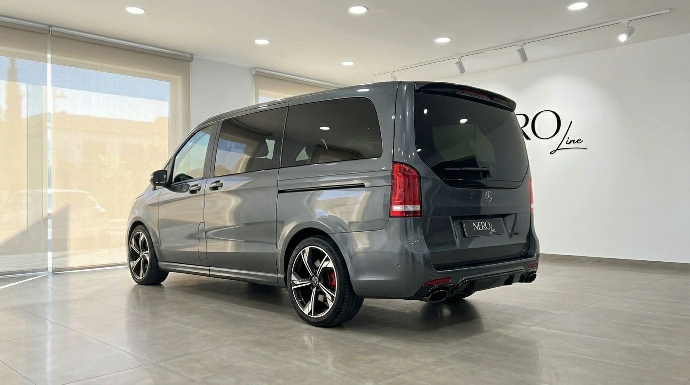 The 2021 Mercedes-Benz V-Class 250d in gloss metallic Daytona Gray, shown from a rear three-quarter angle in a Benidorm showroom.