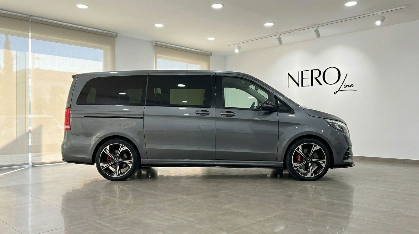 The sleek gloss metallic Daytona Gray Mercedes-Benz V-Class 250d is showcased from its side profile, parked indoors in Benidorm.