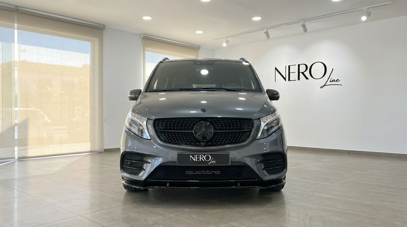 The front view of the Mercedes-Benz V-Class 250d in gloss metallic Daytona Gray, parked in a showroom in Benidorm.